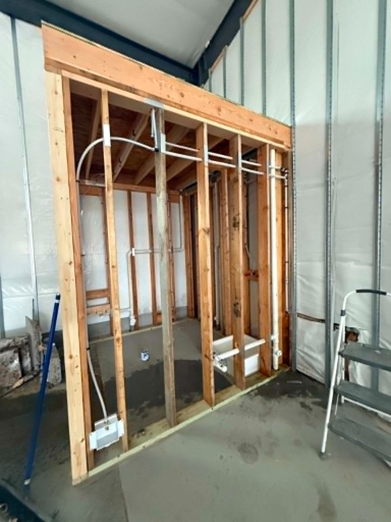 New construction plumbing rough-in inside framed walls