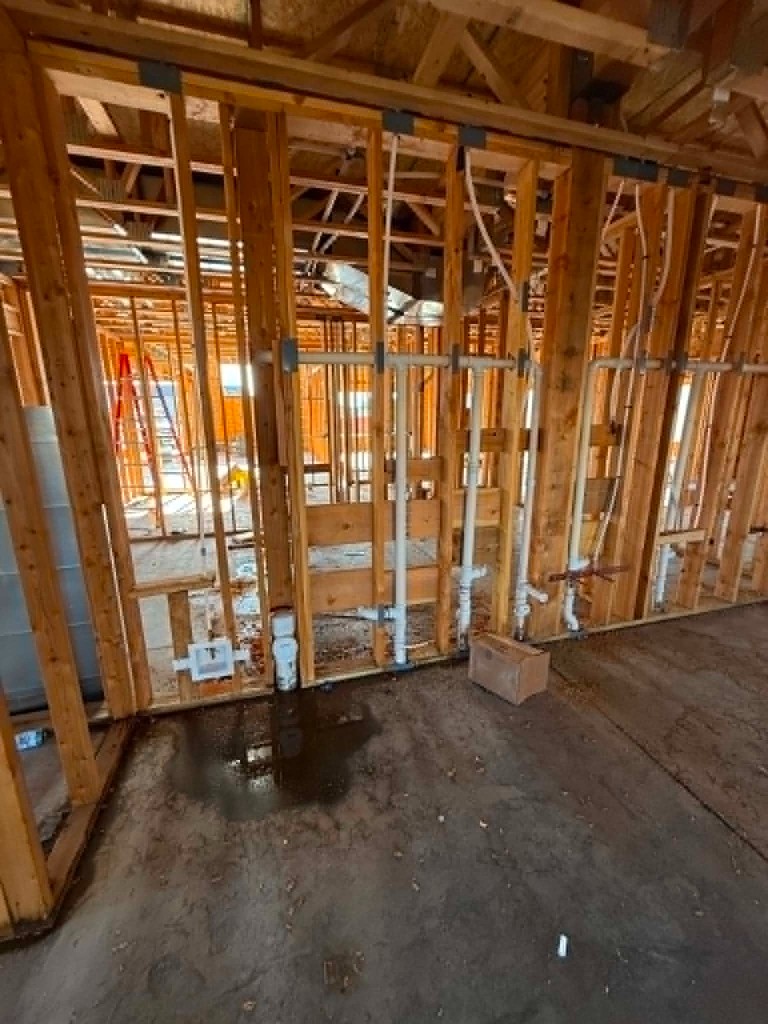 Interior framing with multiple drain and vent lines during rough-in