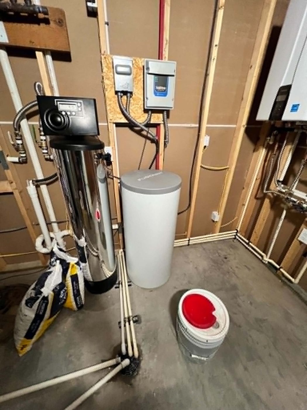 Water softener and filtration system installed in a utility room